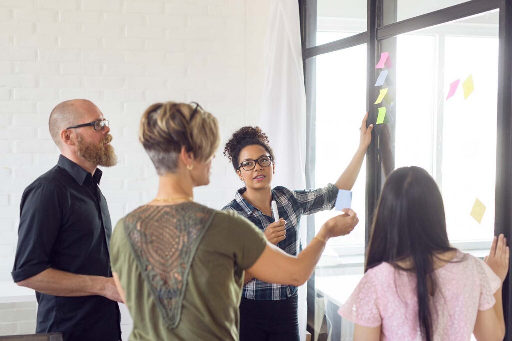 Office Workers Collaborating with Post it notes